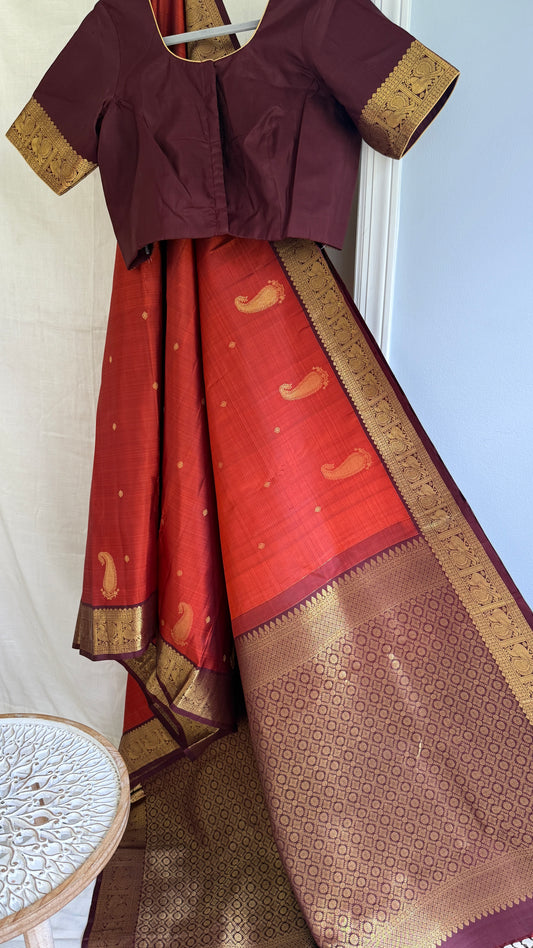 Tangerine rust orange   wirh deep chocolate  brown shot purple silk Kanchipuram saree with vanasringaram border and Pallu
