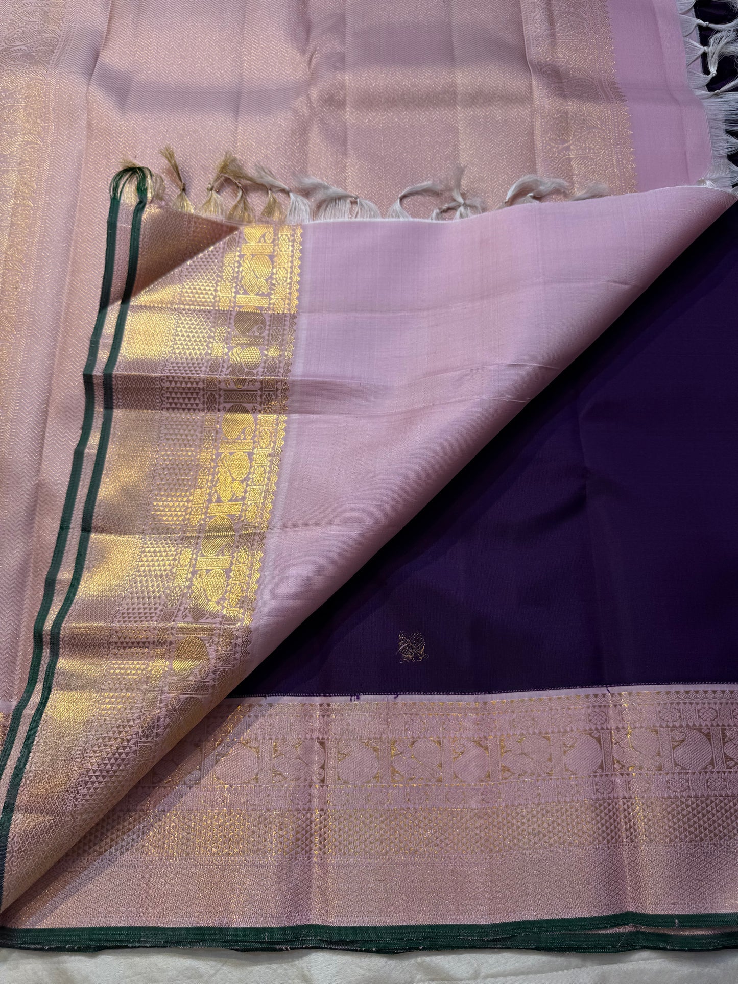 violet Sorgavasal mayil — Pure Silk Kanchipuram Saree
Deep violet body with antique-gold zari chakram buttas and petal-pink brocade mayil (peacock) borders
Silk Mark Certified ✅ • Ships in Two Weeks ✅ • Free Shipping within USA 🇺🇸