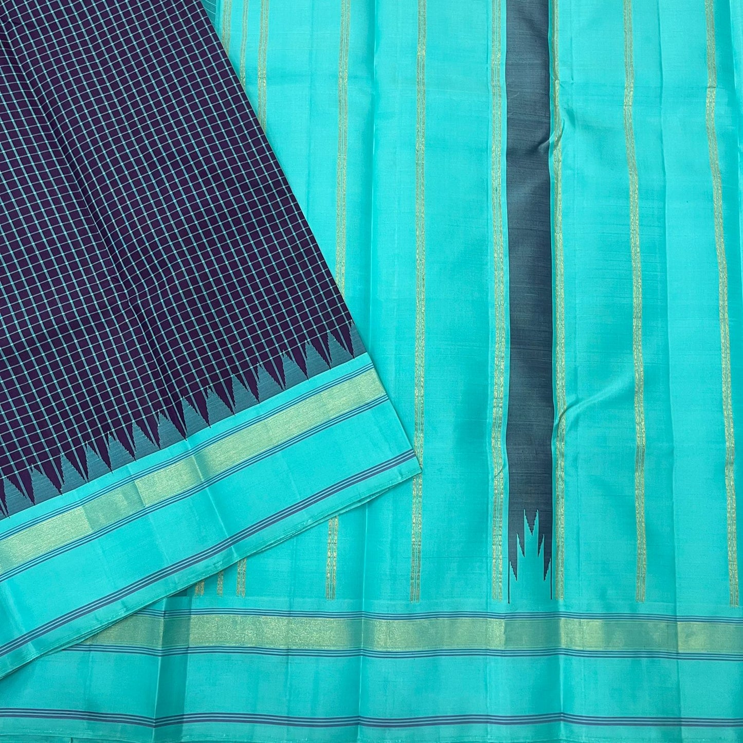 Pure Handwoven Kanchipuram Silk Saree – Deep Aubergine Body with Micro Checks
Contrasting Aqua Blue Korvai Borders with Temple Motifs & silk thread Stripes
Elegant Striped Aqua seer Pallu
Silk Mark Certified ✅ ships in 2 weeks.