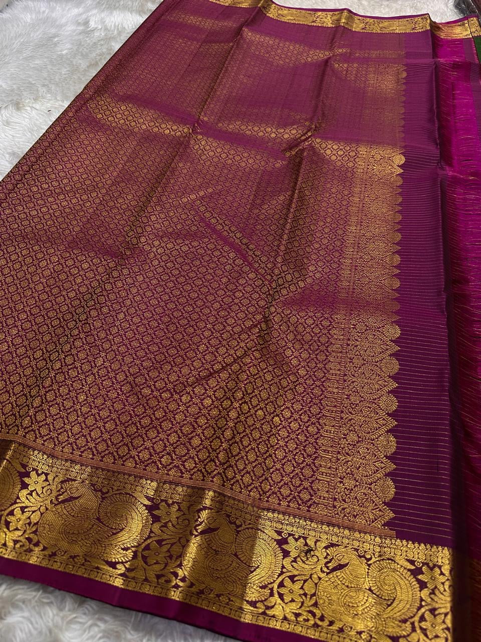 Hemavalli Zari Kattam: Stunning Emerald Green & Rani Pink Korvai Pure Silk Kanchipuram with Gold Zari Checks
Silk Mark Certified for Quality Assurance, Enjoy Free Shipping within USA.
Ready to Ship in 2 Weeks with Majestic Peacock Borders.