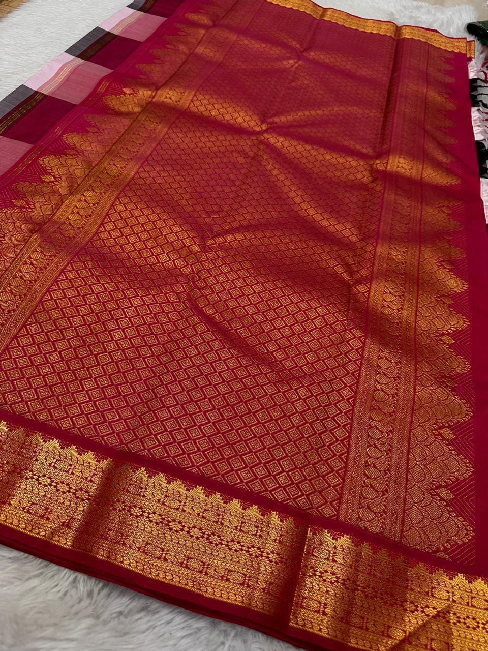 Charcoal Ash Blush Kattam
Pure Kanchipuram Silk Saree – Charcoal Grey, Black & Blush Pink Checks
Contrast deep red korvai borders with intricate gold zari temple motifs
Grand zari pallu, silk mark certified.ships in 2 weeks