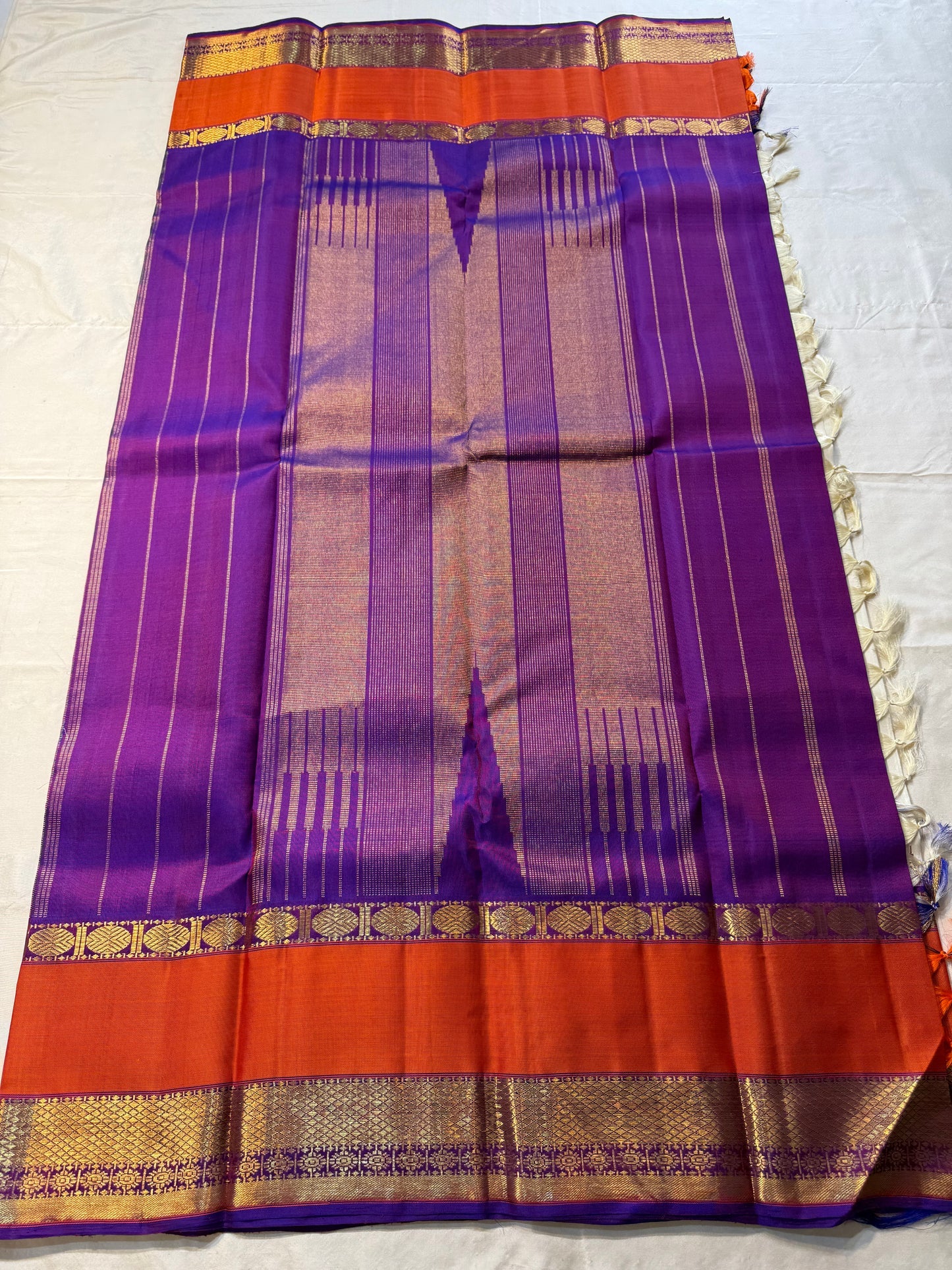 Ivory Temple Glow – Pure Kanchipuram Silk Saree
Ivory Body with Saffron Temple (Gopuram) pillayar moggu
Amethyst-Purple Zari Border with Floral Vines 🌸
Grand Purple Pallu in Rich Zari
Silk Mark Certified, delivery in 2 weeks