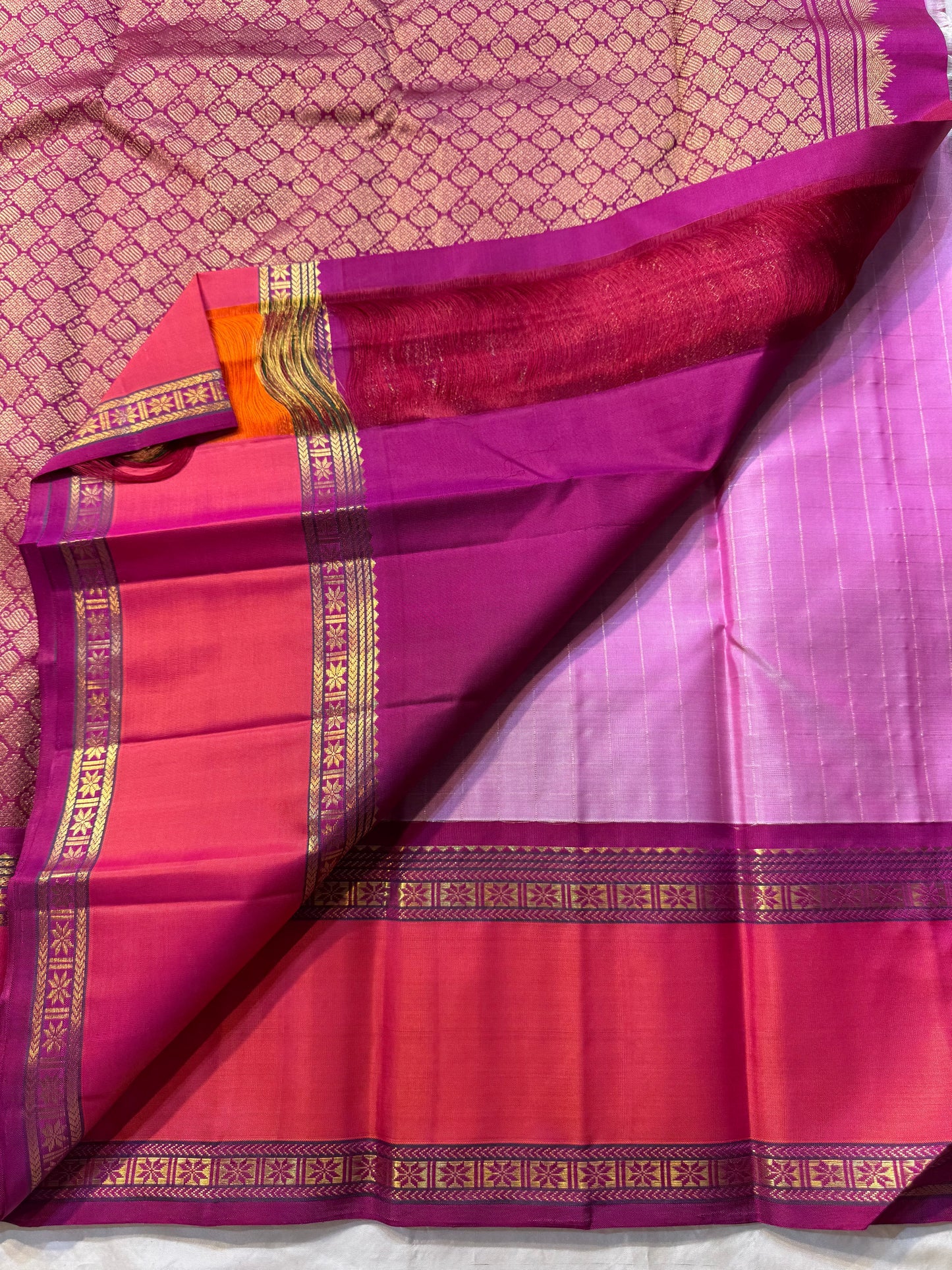 Gulabi Kattam – Pure Kanchipuram Silk Saree
Pastel Pink Body with Fine Zari Grid Checks
Raspberry Korvai Borders with Floral Zari Work
Grand Raspberry–Magenta Brocade Pallu
Silk Mark Certified | Fall & Pico Done | | ships in 2 weeks