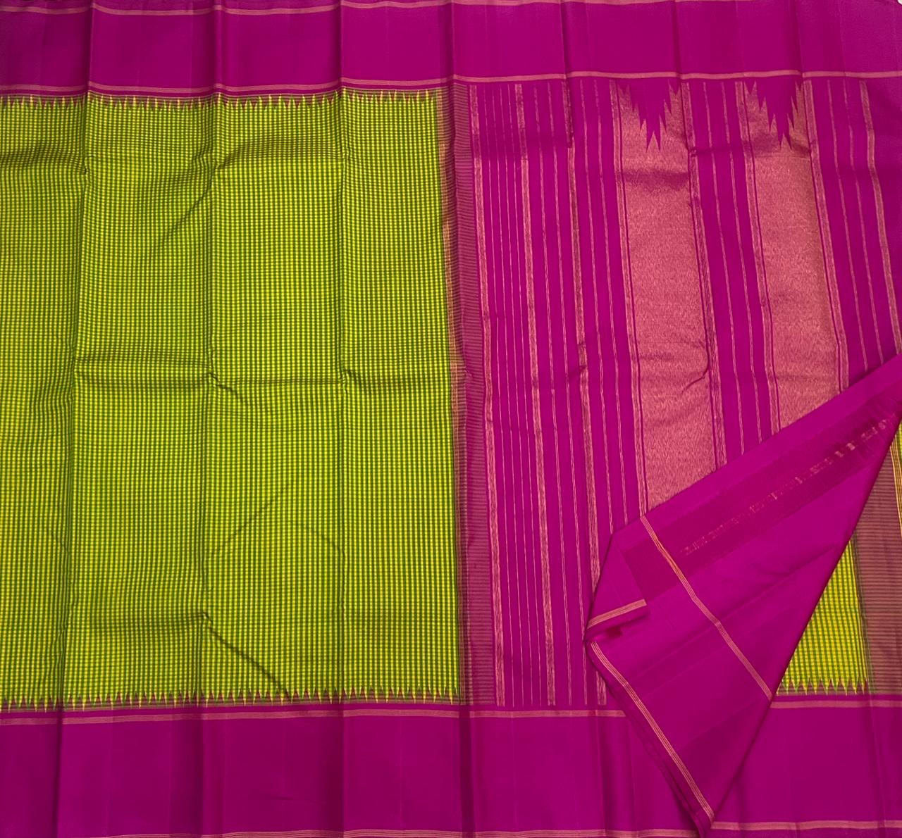 Rose Garden | Korvai Kanchipuram Pure Silk Saree
Magenta-rose body with parrot green micro-checks & temple Korvai join
Rettai pettu striped zari pallu | Contrast magenta blouse
Silk Mark Certified | Dry clean only
Ships in 1 week | Free Shipping USA