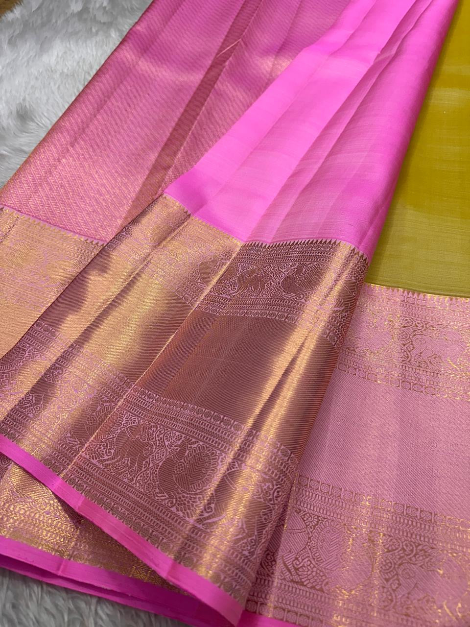 The color of “festive” vibrant golden sampanga with a pink border and Pallu pure silk Kanchipuram saree bavanji rettapet vanasringaram border