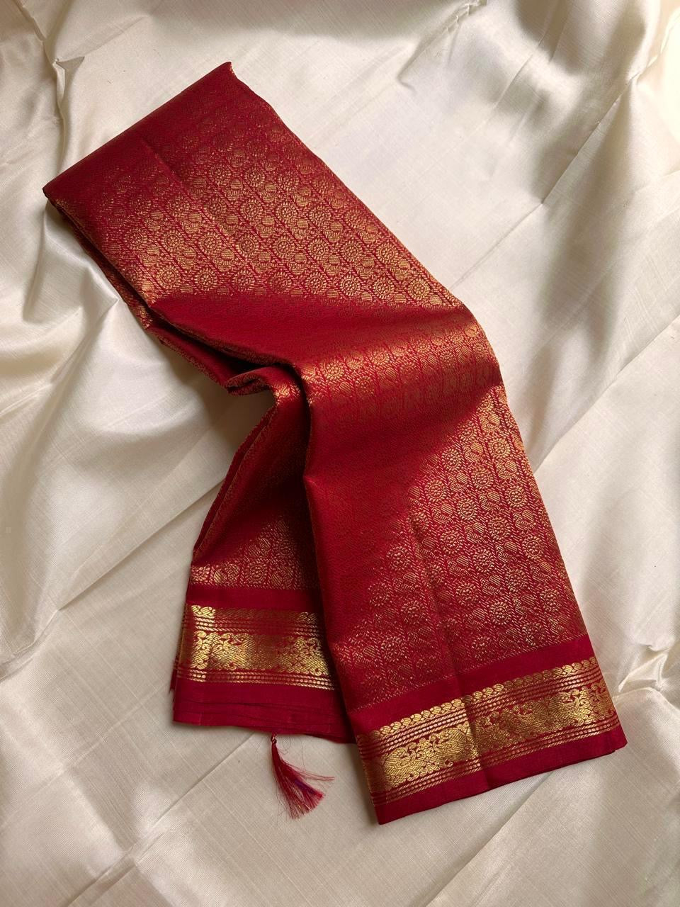 Ratna Rekha — Pure Silk Kanchipuram Saree
Deep kumkum red body with gold coin buttas, rich woven zari jaal pallu, and antique-gold floral borders.
Silk Mark Certified • Blouse Stitching ($30) • Free USA Shipping • Ships in 1 Week