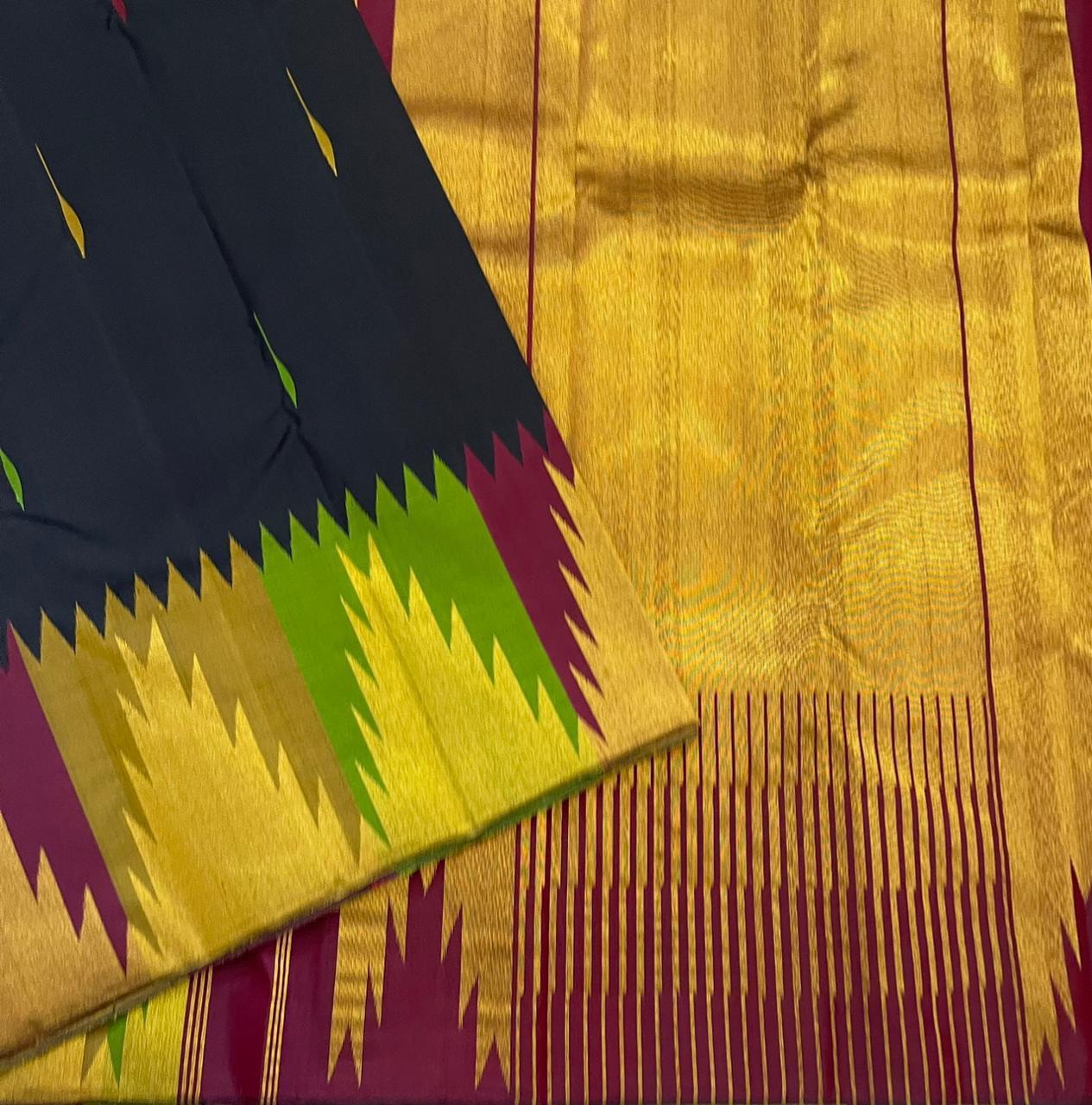 Ettukol Karuppu — Pure Silk Kanchipuram
Inky-black body with parrot-green & mustard buttas, korvai temple peaks in gold, wine & green ✨
Silk Mark Certified • Ships in Two Weeks • Free Shipping within USA