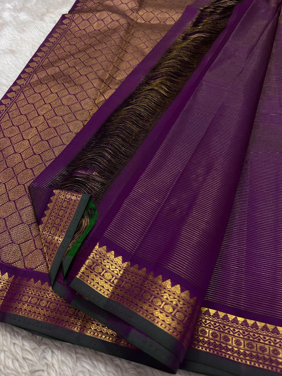 Purple Gandaberunda Vairaoosi — Pure Silk Kanchipuram Saree
Royal purple vairaoosi stripes with antique-gold Gandaberunda buttas & temple border.
Silk Mark Certified · Free USA Shipping · Ships in 2 Weeks ✨