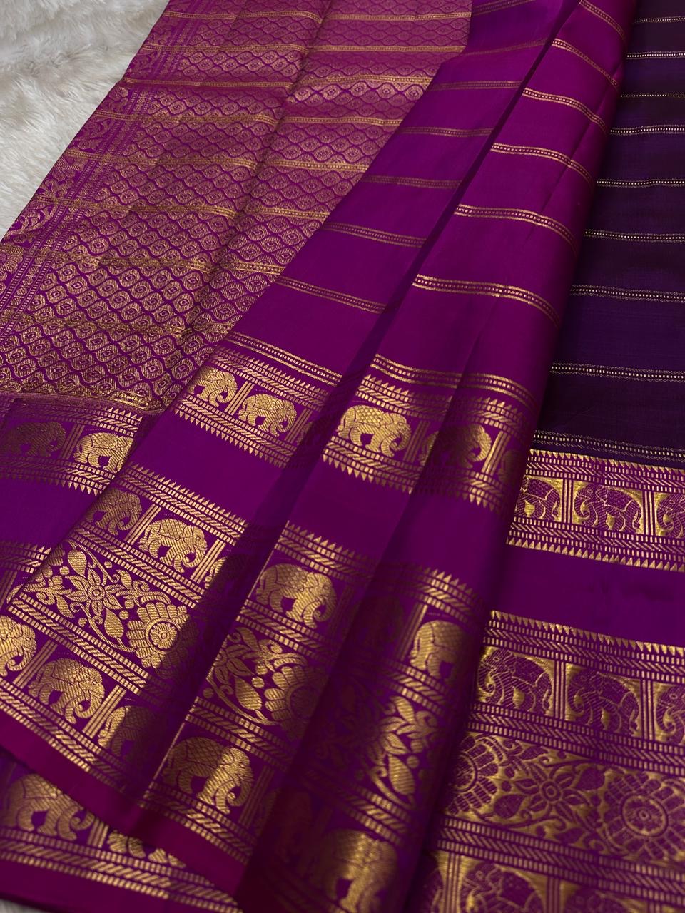 Rani Pink Plum Zari Stripes – Pure Kanchipuram Silk Saree
Plum purple body with rani-pink korvai borders & grand zari pallu
Elephants & floral mandalas woven in gold zari
Silk Mark Certified | Blouse Piece Included | Fall & Pico Done
Free shipping