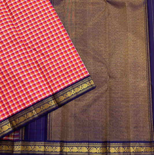 Rani Kanthi — Pure Silk Kanchipuram Saree
Sunset-orange, rani-pink & haldi-yellow kattam checks ✨
Navy korvai borders with intricate gold zari vines
Rich navy pallu with zari pinstripes & tasseled finish
Silk Mark Certified • Free USA Shipping in 1 week