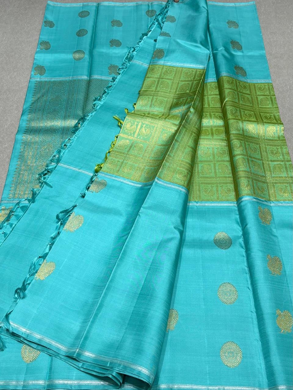 Aaral – Ice Blue & Spring Green Mubbagam Kanchipuram Pure Silk Saree with Mayil Chakram Buttas & Vanasringaram Grid Pallu