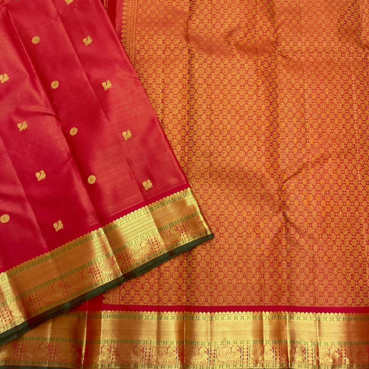 Sringaram Red Vairaoosi – Pure Kanchipuram Silk Saree
Red body with zari coin & floral buttas;
Broad gold border with vairaoosi l & peacock panel; Zari pallu
Silk Mark Certified | Blouse Piece Included | Fall & Pico Done
…read description