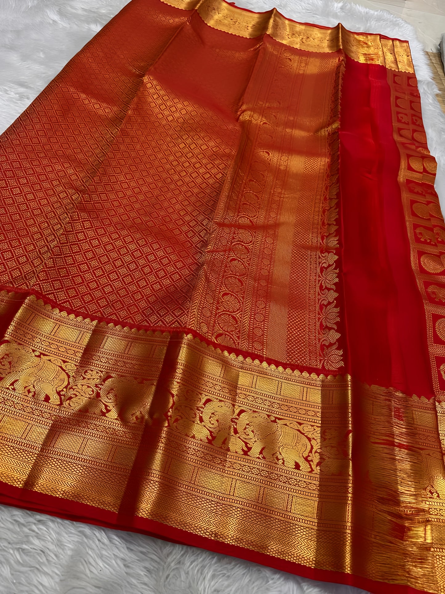 Opulent red Zari kattam with elephant and kamalam motifs spread all over pure silk Kanchipuram saree