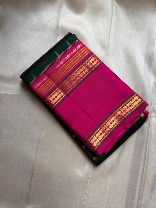 Rani Maragatham Zari Kattam — Pure Silk Kanchipuram (Handloom)
Emerald green body with fine gold kattam checks & zari lines • Vibrant rani-pink border with temple coin motifs
Rich rani-pink pallu with antique-gold zari panels • Silk Mark Certified ✅ Free