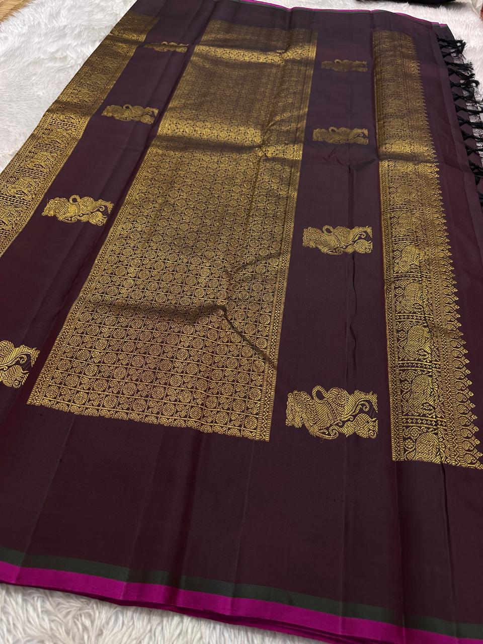 Lavanya– deep brown Handwoven Kanchipuram Silk Saree in Brown with Gold & Silver Zari, this deep brown Kanchipuram silk saree with intricate motifs in gold and silver zari, including Gandaberunda, parrots, elephants &lotuses as seen on Nita Ambani