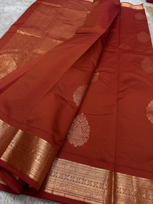 Thamarai — Copper Brown — Pure Kanchipuram Silk Saree
Copper Brown with Gold Zari Leaf Buttas & Diamond Jaal Pallu
Silk Mark Certified • Free Shipping within USA • Ships in Two Weeks