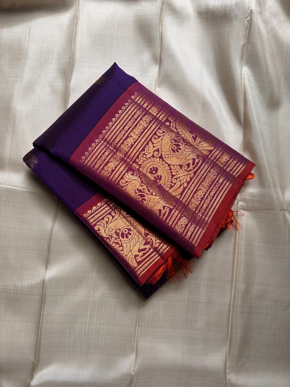 Royal purple and orange red double shade shot color Pallu pure silk Kanchipuram with ornate border featuring Peacock motifs