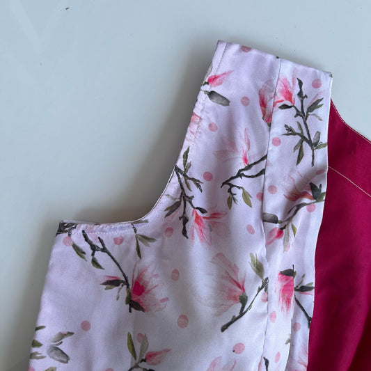 Magnolia satin silk blouse side view showing sleeveless cut and floral print