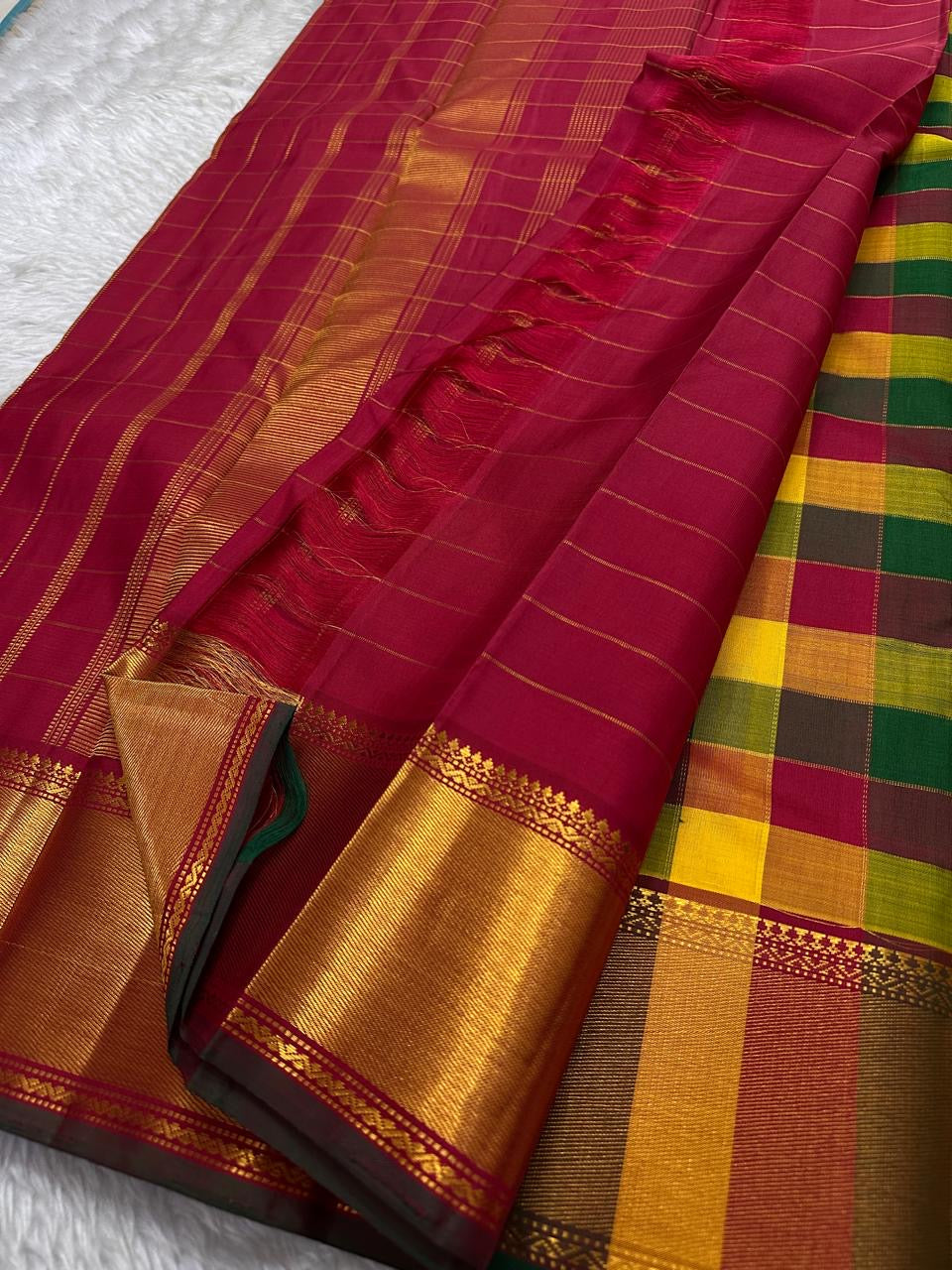 Manjal–Kumkumam Paalum pazhamum Kattam | Pure Silk Kanchipuram
Haldi Yellow • Kumkum Red • Tulasi Green Paalum-Pazhamum Checks
Korvai Maroon Border • Rich Gold Zari • seer Zari Pallu with Tassels
Silk Mark Certified • Free Shipping within USA 2 weeks