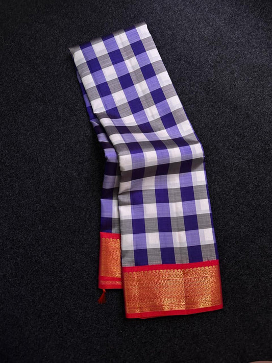 ✨ Varnika Checks — Pure Silk Kanchipuram Saree (Kattam)
Indigo–lavender–ivory checks with roja-red zari borders & rani contrast pallu
Silk Mark Certified ✅ • Ships in Two Weeks • Free Shipping within USA 🇺🇸