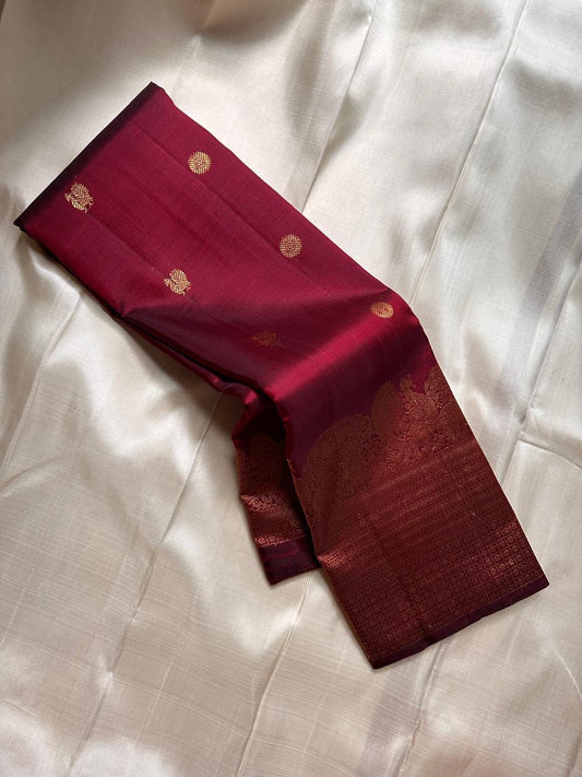 Lotus Glow — Maroon Brown | Pure Kanchipuram Silk Saree
A rich maroon-brown canvas with gold zari peacocks, elephants & lotus motifs 🌸
Silk Mark Certified • Free USA Shipping • Ships in Two Weeks