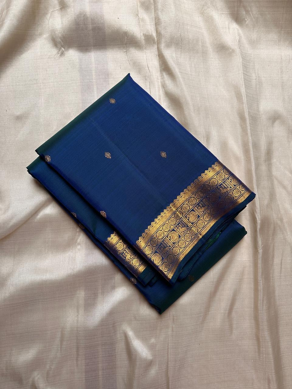 Indira – Peacock Blue-Green Kanchipuram Pure Silk Saree with Zari Butta & muthu seer and rudraksham Pettu Border
