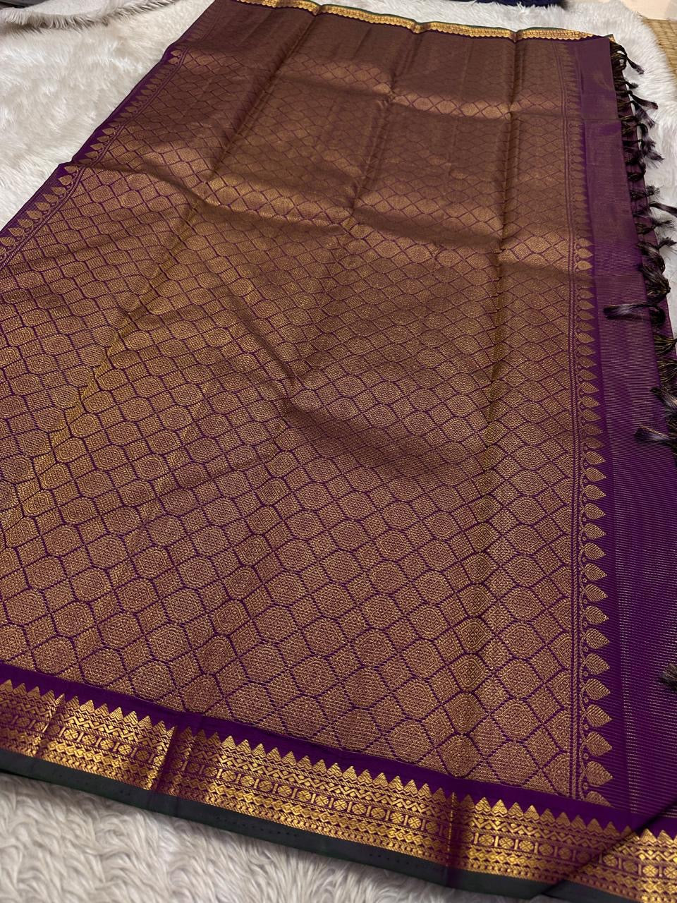 Purple Gandaberunda Vairaoosi — Pure Silk Kanchipuram Saree
Royal purple vairaoosi stripes with antique-gold Gandaberunda buttas & temple border.
Silk Mark Certified · Free USA Shipping · Ships in 2 Weeks ✨