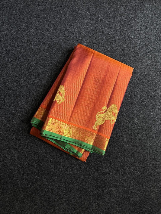 Rust Orange Yazhi Vairaoosi — Pure Silk Kanchipuram Saree
Rust orange body with fine vaira oosi lines and regal Yazhi zari motifs
Antique gold borders with green selvedge and grand brocade pallu ✨
Silk Mark Certified • Free USA Shipping • Ships in Two We