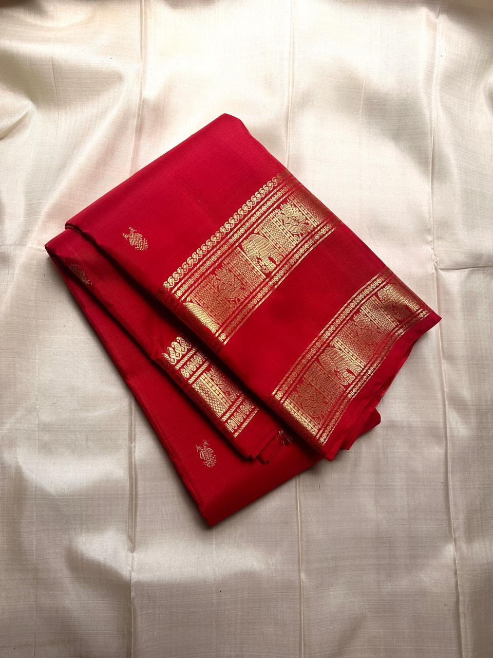 Drenched in the richness of crimson , woven with pride - Gandaberunda motifs all over body rettapettu border with vanasringaram motifs