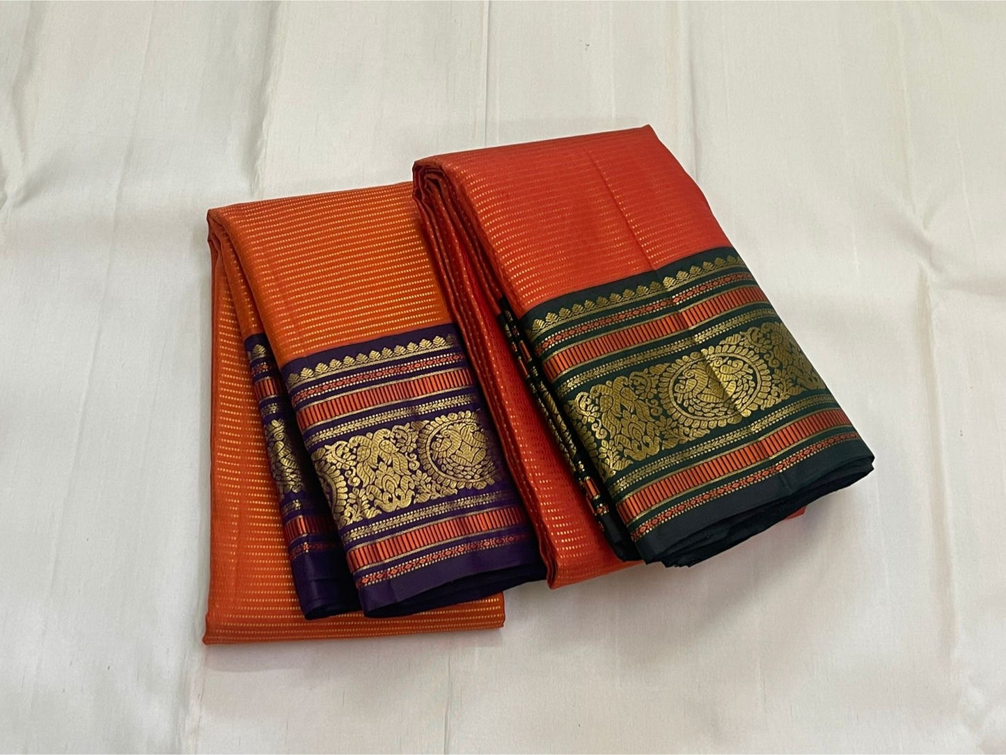 Kesari Annapakshi Chakram
Pure Kanchipuram Silk Saree – Vibrant Kesari Orange Body with Gold Zari Chakram Buttas
Deep Purple Korvai Borders with Majestic Annapakshi & Floral Motifs
Grand Purple Zari Pallu. Silk mark certified , ships in 2 weeks
