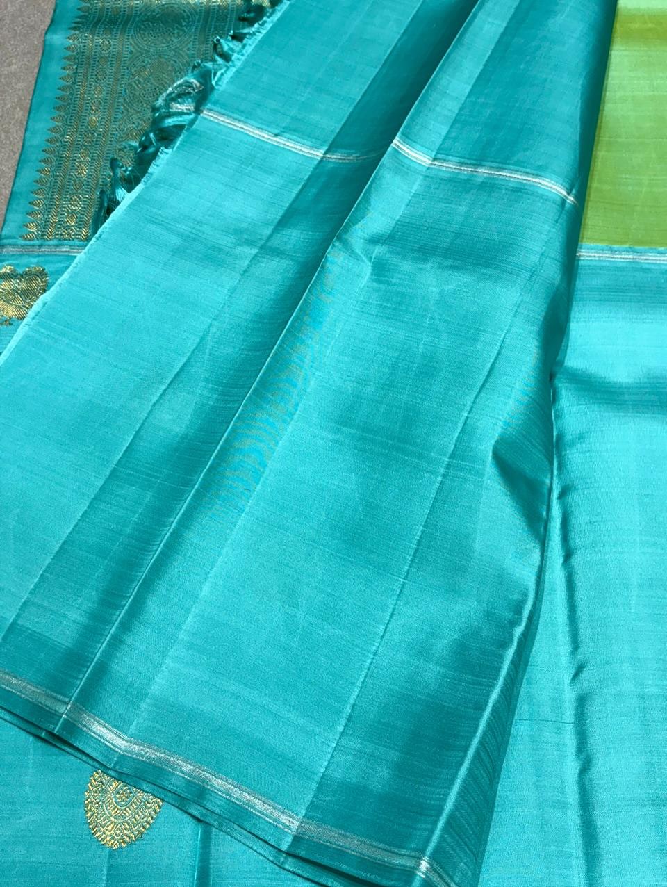 Aaral – Ice Blue & Spring Green Mubbagam Kanchipuram Pure Silk Saree with Mayil Chakram Buttas & Vanasringaram Grid Pallu