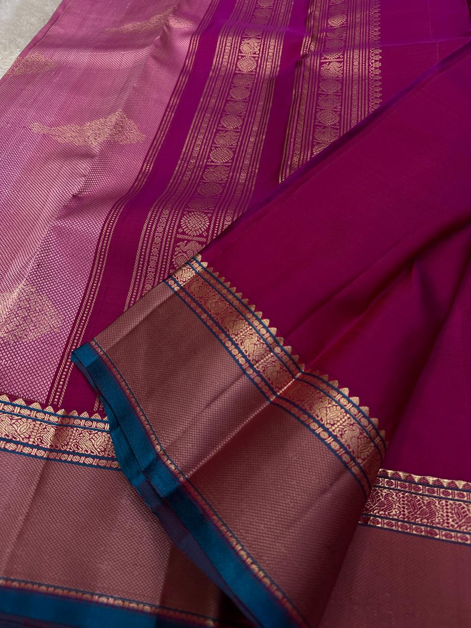 Pink Lily — Pure Silk Kanchipuram
Rani-pink body with zari buttas, dusty-mauve korvai borders & teal selvedge highlights ✨
Silk Mark Certified • Antique Zari Weave • Ships in Two Weeks • Free Shipping within USA