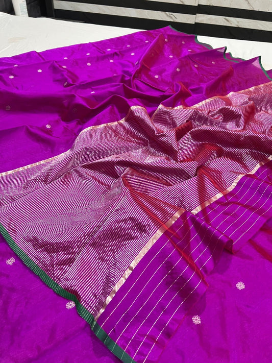 Close view of magenta handloom Chanderi silk with metallic buttas and finely striped woven pallu