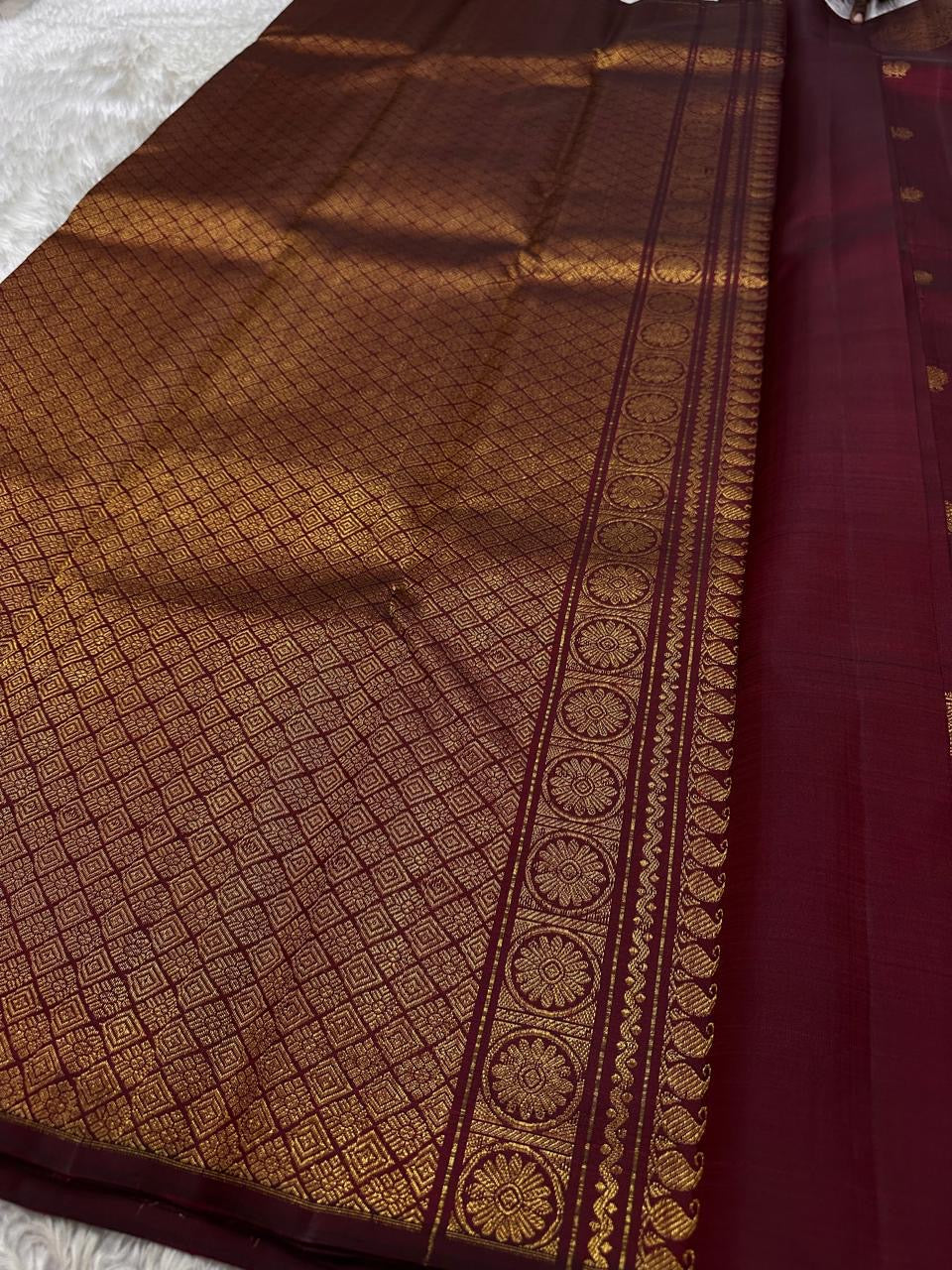 Lotus Glow — Maroon Brown | Pure Kanchipuram Silk Saree
A rich maroon-brown canvas with gold zari peacocks, elephants & lotus motifs 🌸
Silk Mark Certified • Free USA Shipping • Ships in Two Weeks