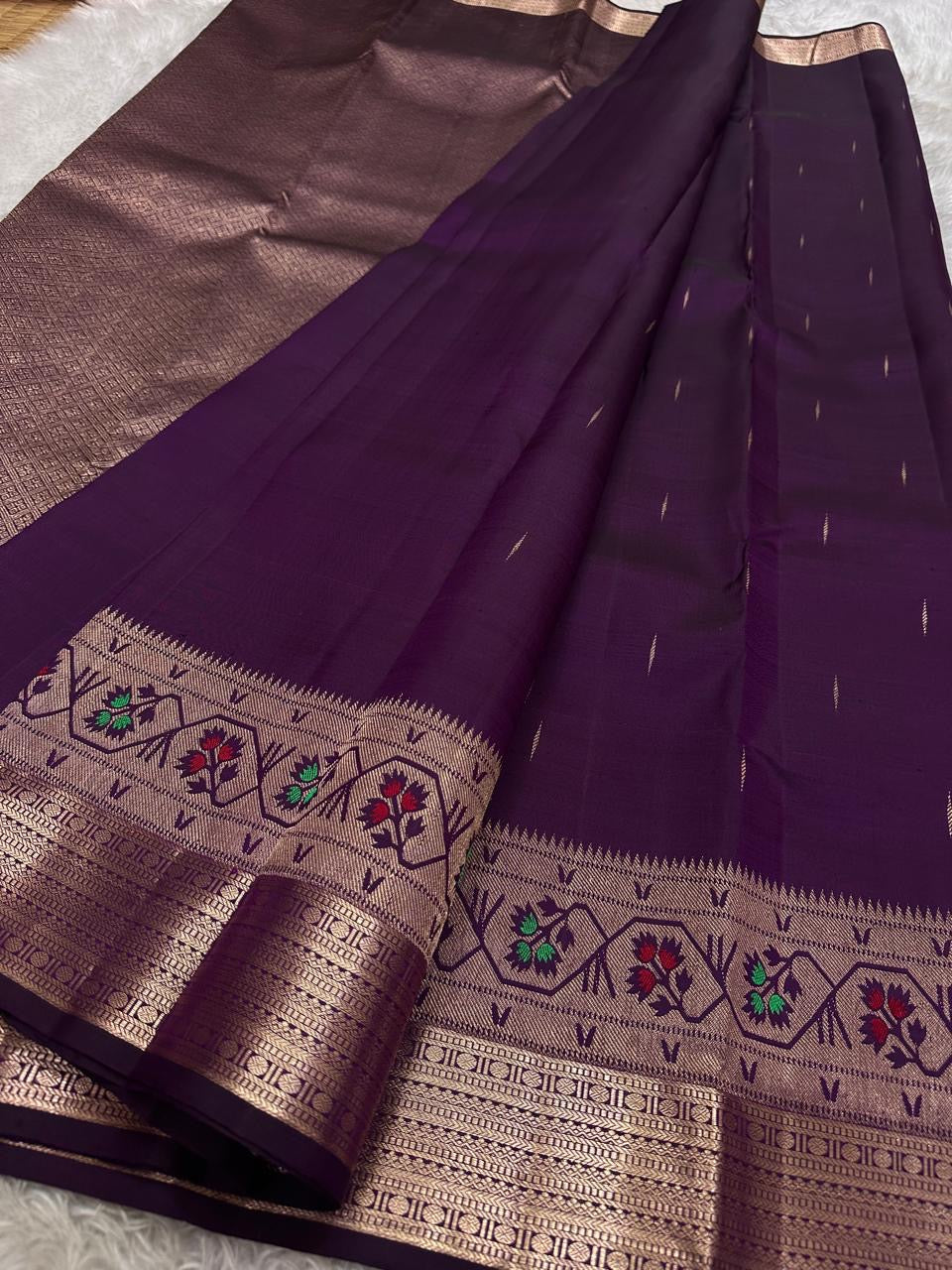Vibha plum - A Deep Plum Pure Kanchipuram Silk Saree Blending the Grandeur of South Indian Weaving with Paithani-Inspired Floral Zari Borders and a Lustrous Rose Gold zari Pallu