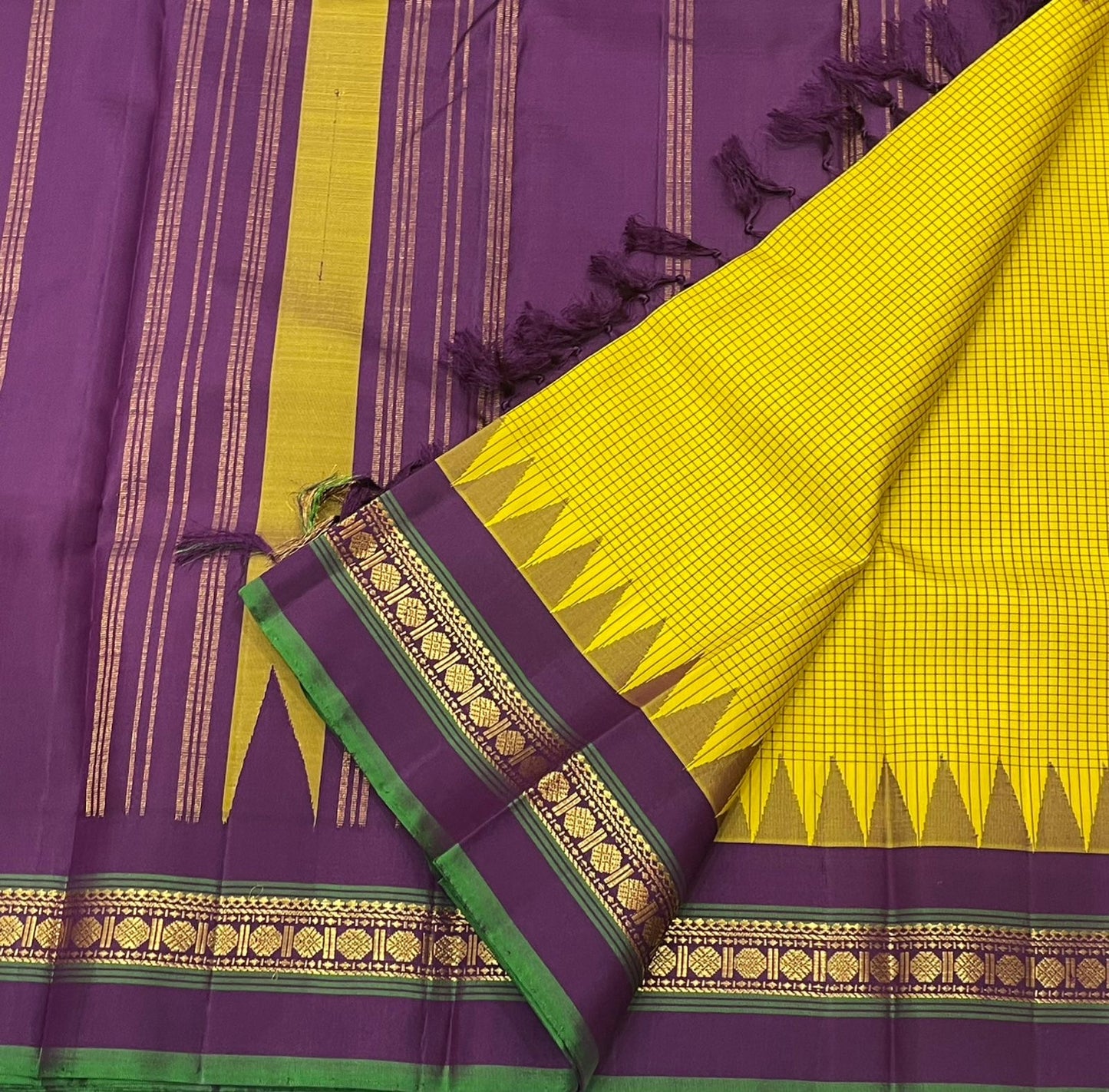 Ochre Turmeric Kattam
Pure Kanchipuram Silk Saree – Ochre Yellow Body with Fine Kattam Checks
Contrast Korvai Borders with Temple Serrations & Floral Zari
Grand Zari Brocade Pallu with Hand-Knotted Tassels
Silk Mark Certified ✅ |ships in 2 weeks