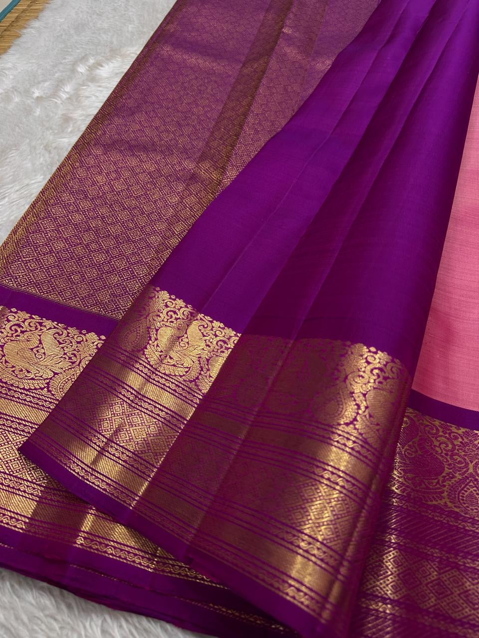 A dazzling blend of pink and purple silk, enriched with golden zari for a look that’s both festive and feminine.