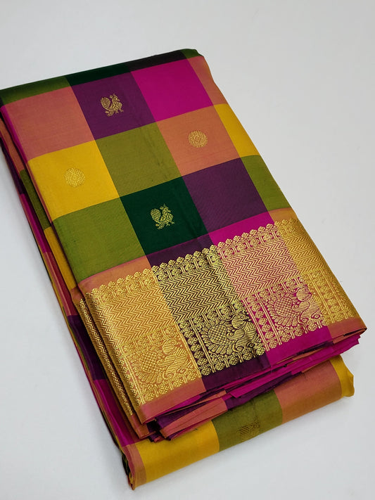 Sunset Mosaic – Paalum Pazhamum – Pure Kanchipuram Silk Saree
Vibrant Multicolored Checks in Yellow, Green, Rust & Maroon
Golden Zari Borders with Traditional Intricate Weaves
Silk Mark Certified, delivery in 2 weeks
