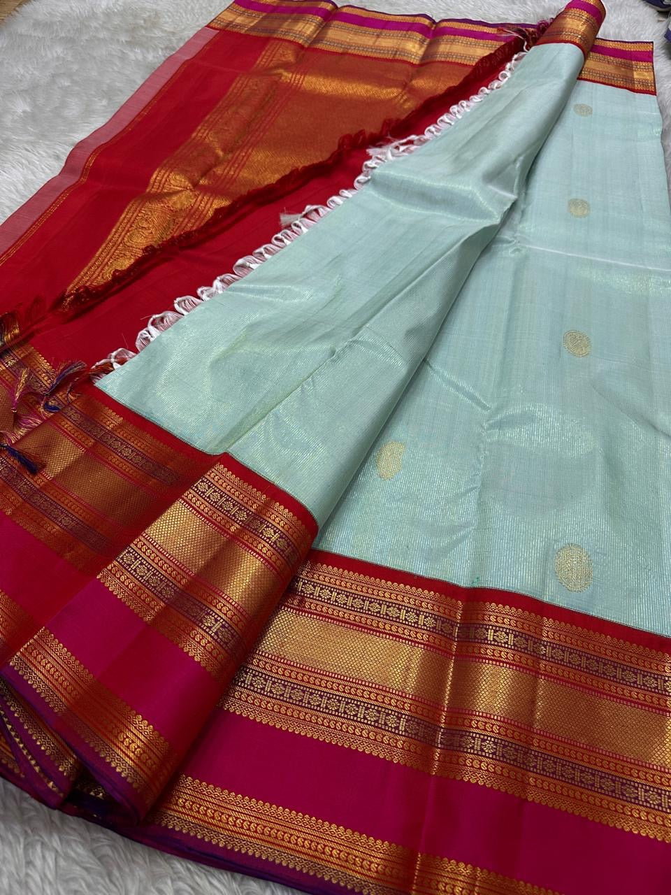 Sky Blue Vairaoosi — Pure Silk Kanchipuram Saree
Rani Pink Korvai Border & Red Brocade Pallu
Silk Mark Certified • Free USA Shipping • Ships in Two Weeks