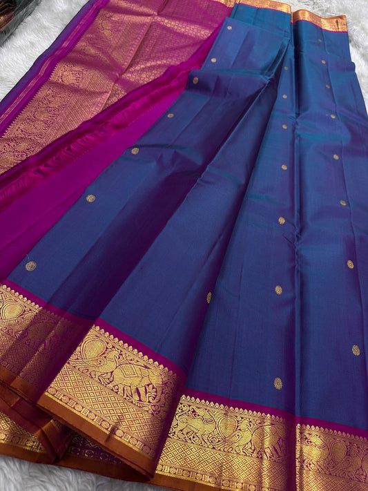 Lotus Crest Blue — Pure Kanchipuram Silk Saree Peacock–blue body with gold buttas & magenta elephant zari-woven borders Silk Mark Certified • Free Shipping within USA • Ships in Two Weeks