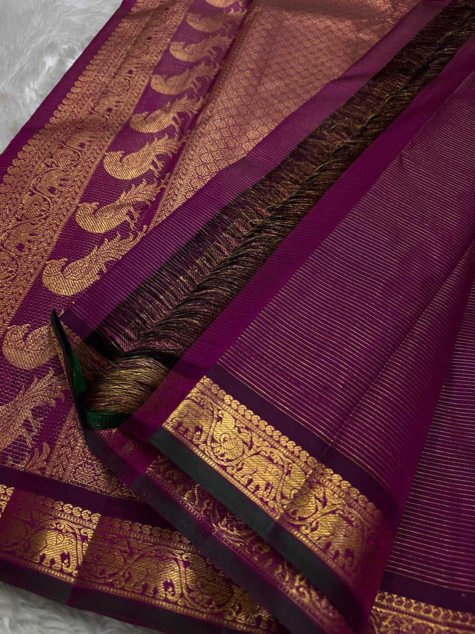 Purple Mayil Vairaoosi — Pure Silk Kanchipuram Saree
Royal purple body in fine vairaoosi pin-stripes with gold mayil motifs
Antique-gold zari borders, copper-rose brocade pallu & black selvedge ✨
Silk Mark Certified • Free USA Shipping • Ships in Two Week