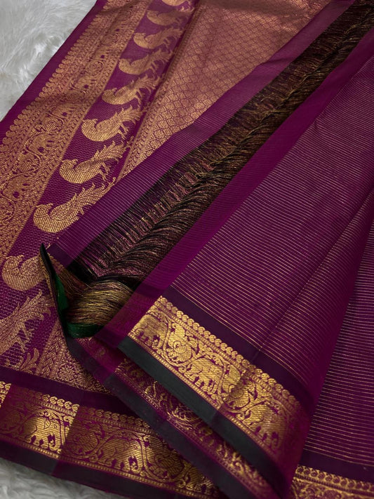 Purple Mayil Vairaoosi — Pure Silk Kanchipuram Saree
Royal purple body in fine vairaoosi pin-stripes with gold mayil motifs
Antique-gold zari borders, copper-rose brocade pallu & black selvedge ✨
Silk Mark Certified • Free USA Shipping • Ships in Two Week