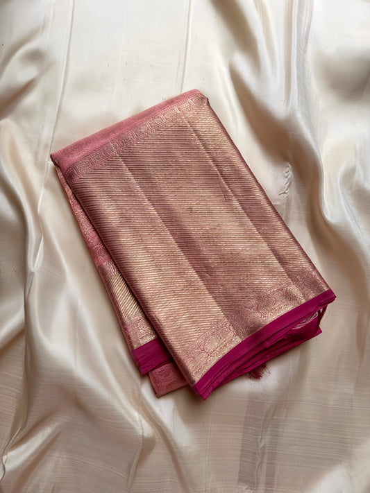 Pure handloom Kanchipuram silk saree with 3g gold zari ( testing certificate provided ) 
pastel pink  with thick bavanji  woven border and classic mayil chakram butta motif all over