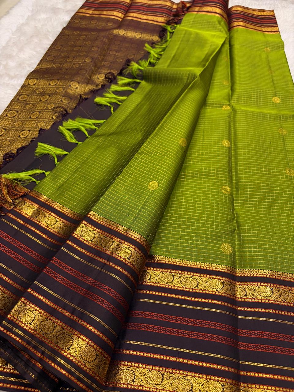 Handwoven pure silk saree from Kanchipuram with Varisaipet weave in olive green and charcoal