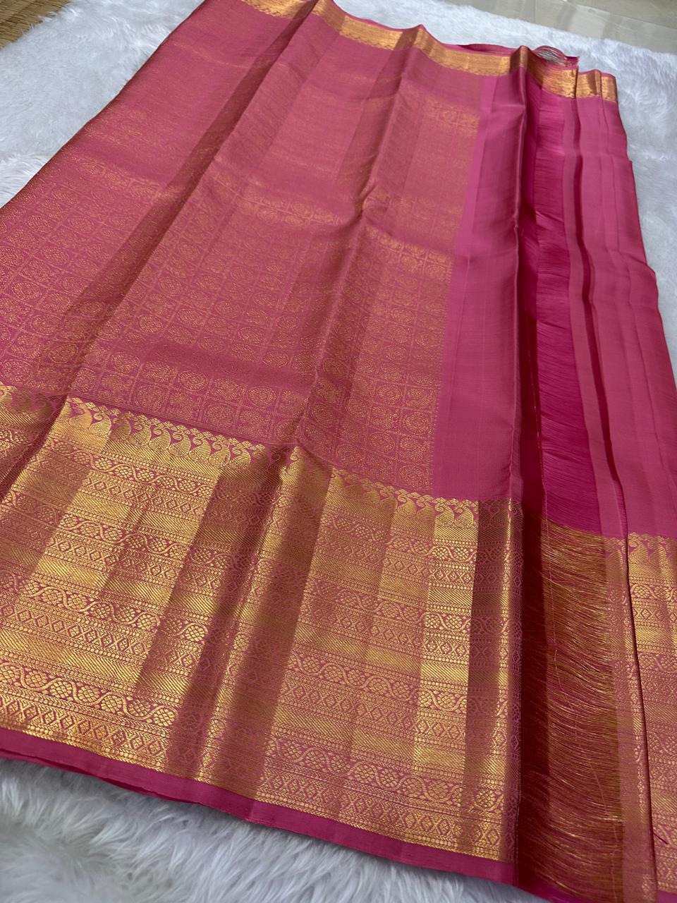 Pretty pink adukkupet pure silk kanjivaram with the Zari Mogra motif inspired by banarasi silks, chakram and mayil grid border