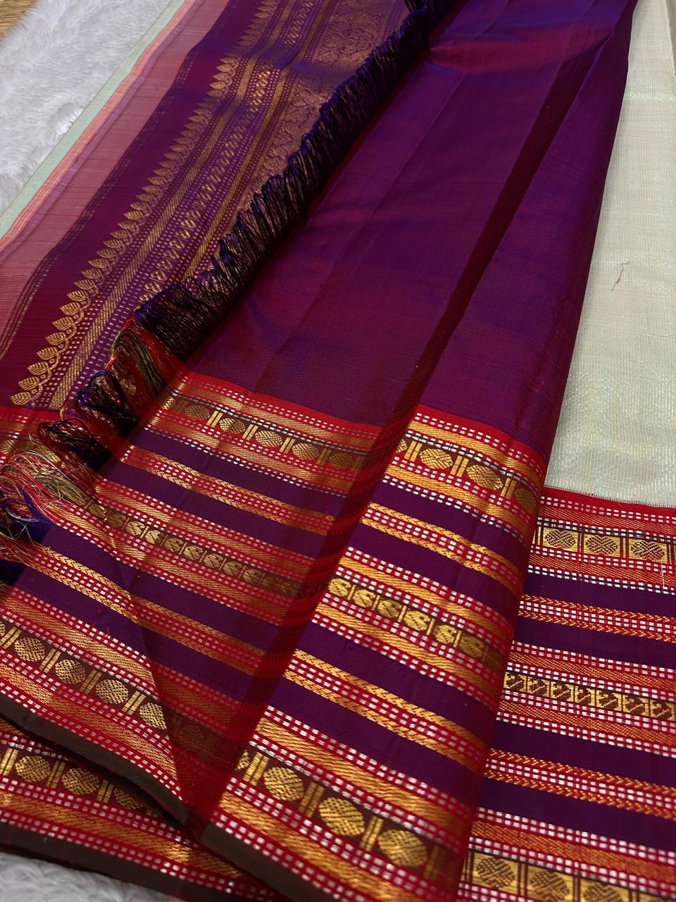 Pure silk kanchipuram grey with sampanga green vairaoosi with detailed ornate varisaipet border thandavalam zari , mayil Butta