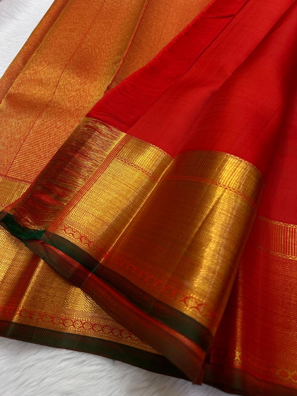 Kirtan ✨ – Vermilion Red Kanchipuram Pure Silk Saree
with Intricate Gold Zari Kattam Checks
Broad Lustrous Golden Border with Green Selvedge 🌿
Grand Radiant Pallu in Red & Gold Weaves
An Heirloom of Tradition, Festivity & Grace