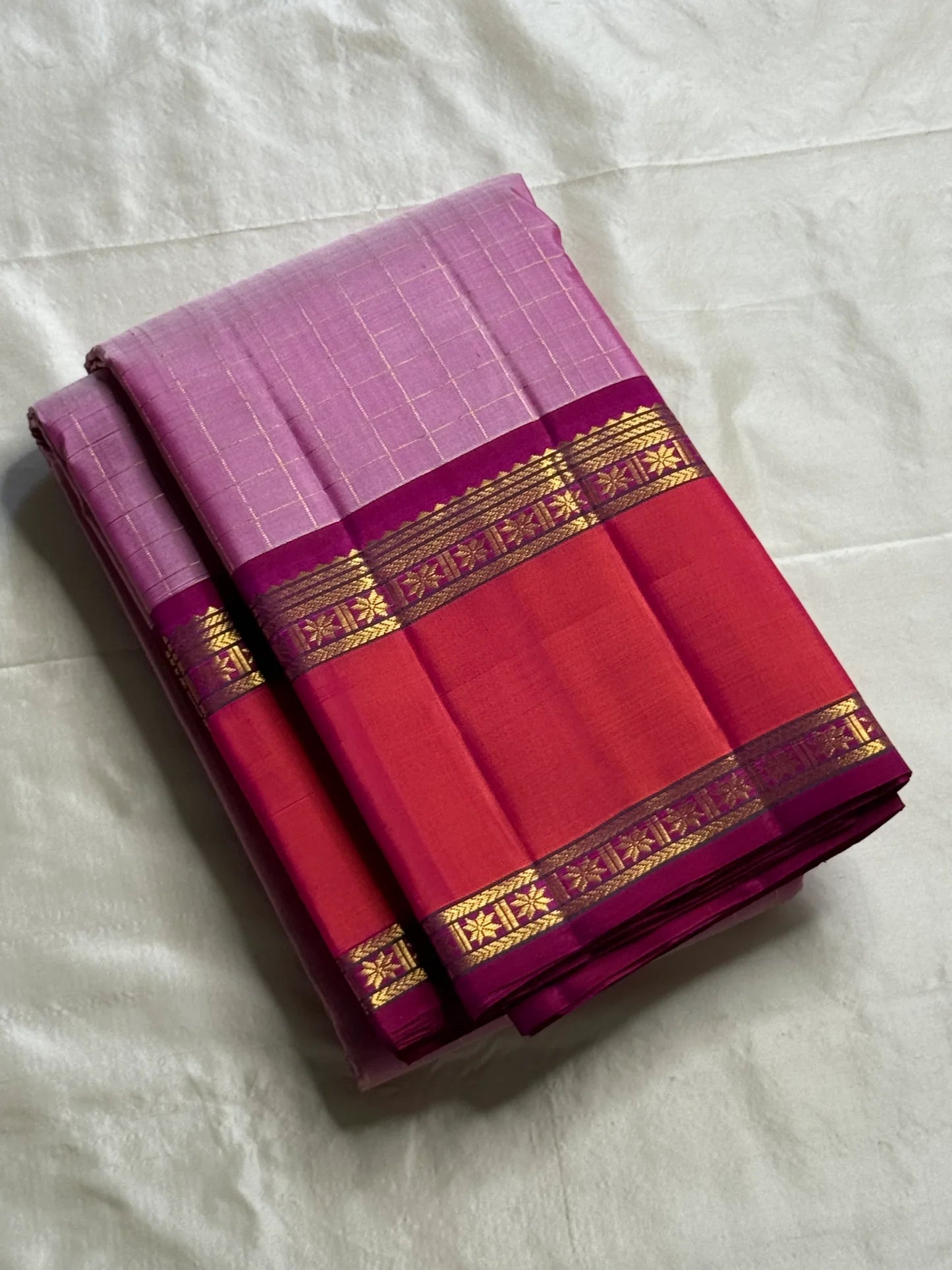 Gulabi Kattam – Pure Kanchipuram Silk Saree
Pastel Pink Body with Fine Zari Grid Checks
Raspberry Korvai Borders with Floral Zari Work
Grand Raspberry–Magenta Brocade Pallu
Silk Mark Certified | Fall & Pico Done | | ships in 2 weeks