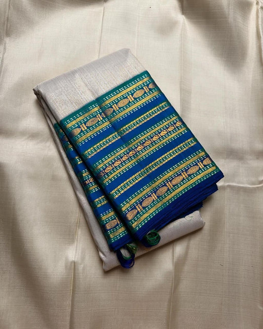 Pure silk kanchipuram handloom saree a unique white vairaoosi with blue sapphire varisaipet border with Rudhraksham motif