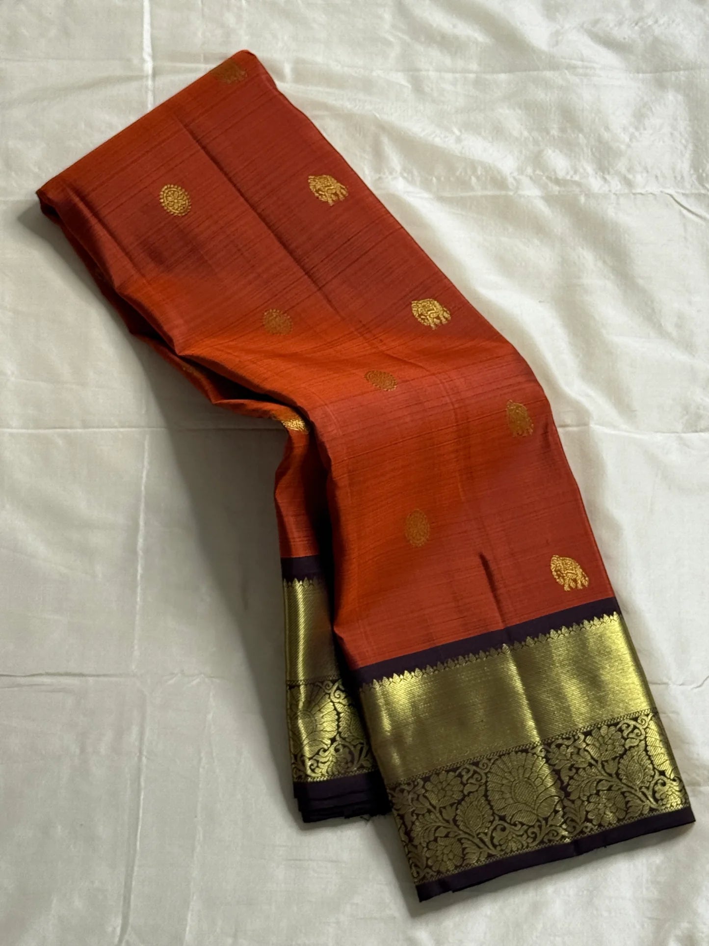 Rust orange Terracotta, Yanai Butta
 — Coffee Brown Korvai Kanchipuram
Deep coffee-brown korvai borders with wide antique-gold kaddi & floral vines
Silk Mark Certified | Free Shipping within USA | Ships in Two Weeks
Blouse Stitching available $30